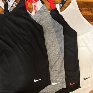 Nike Tank Tops (4) in Black, Gray, and White